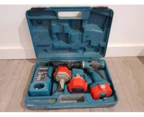 A Makita 14v cordless drill with 2 spare batteries and charger, cased.