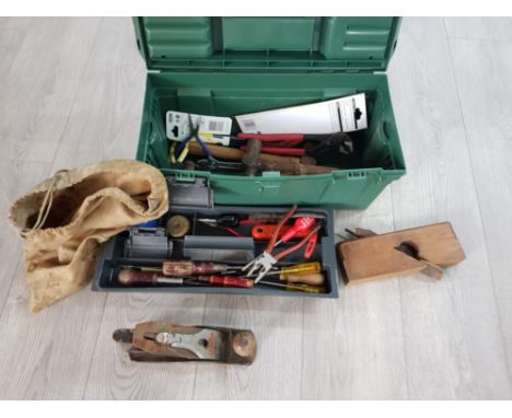 A toolbox with contents to include a Stanley plane, chisels, moulding plane etc.