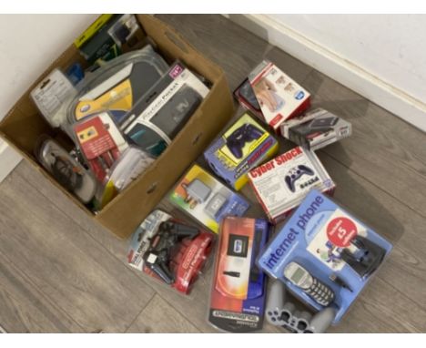 Box of games console leads and controllers including PlayStation, PC and TV accessories