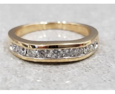 Ladies 14ct yellow gold 1/2 diamond eternity ring, comprising of nine round brilliant cut diamonds set in a chanel setting. 3