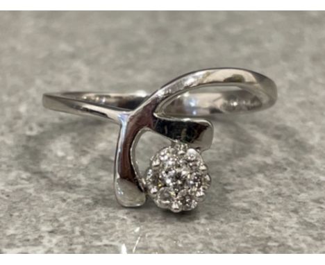 Ladies 18ct white gold diamond cluster ring. Comprising of a cluster of 7 round brilliant cut diamonds. Size M 2.6g