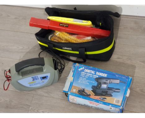 Rolson bag containing miscellaneous hand tools also includes Dual voltage battery charger and orbital sander
