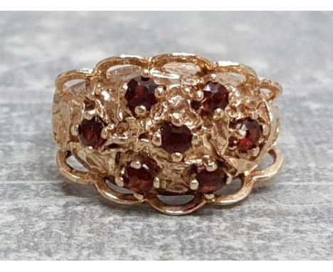 Ladies 9ct yellow gold garnet cluster ring, featuring 7 round garnet stones set in a claw setting, 4.8g size L