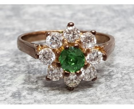 Ladies 9ct yellow gold, green and white stone cluster ring, comprising of a round green stone in the centre surrounded by 8 c