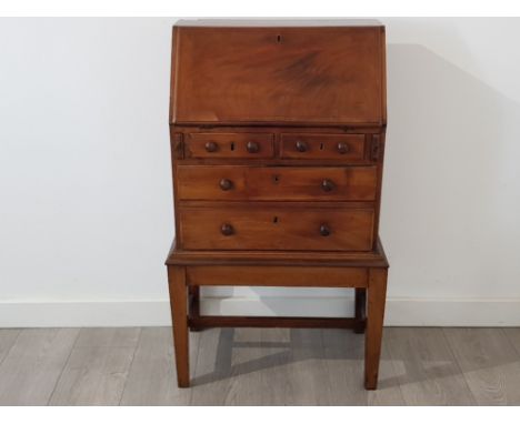 A rare and interesting George III mahogany apprentice/child bureau c1785, the banded front opening to reveal a concave drawer