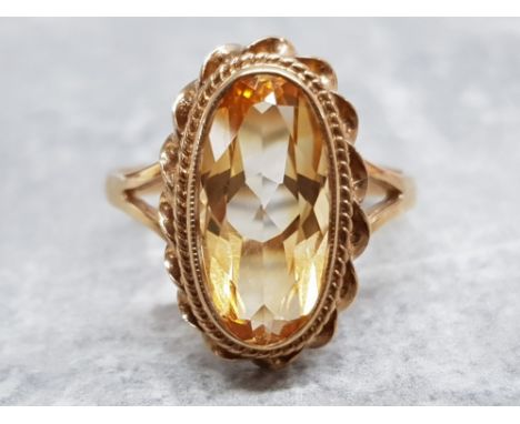 Ladies 9ct yellow gold citrine ring, featuring a oval stone set in a fancy edge, 3.7g size P