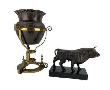 20th century cast metal model of a bull H19cm, together with an Art Nouveau copper planter on an ornate brass openwork stand,