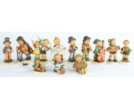 TWELVE GOEBEL FIGURES OF CHILDREN BY M.J. HUMMEL 