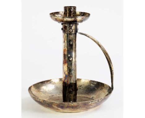 AN ARTS AND CRAFTS SILVER PLATED COPPER HAND CANDLESTICK OF RIVETED CONSTRUCTION AND HAMMER TEXTURED, 20CM H, CIRCA 1900 