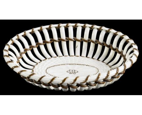 A PARTIALLY MOULDED CREAMWARE OVAL TWIG BASKET, WITH SEPIA ENAMEL DECORATION, 22CM W, CIRCA 1810