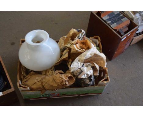 A collection of various oil lamp shades, chimneys etc