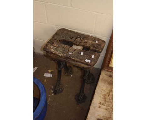 A small cast iron stand or bench marked Saracen