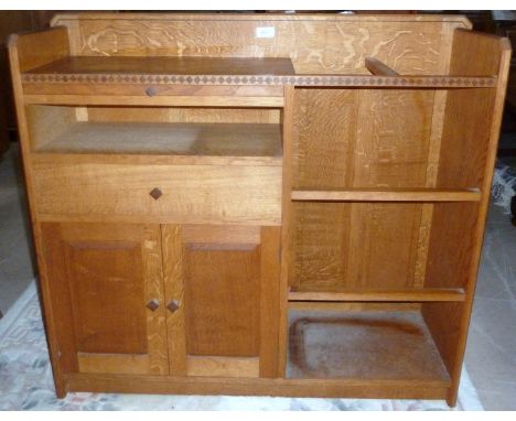 A Cotswold School oak hall/stick stand with integral cupboards and drawersby Gary Olson