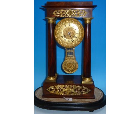 A 19th century figure mahogany and ormolu portico clock with pierced mounts to frieze and base, ormolu capped columns, ornate