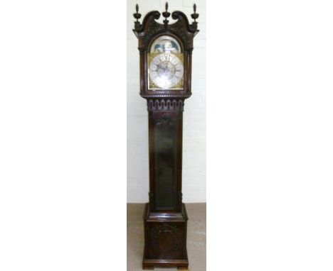 A late 19th century Chippendale revival mahogany longcase clock with extensive carved decoration, the hood with swan neck ped