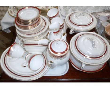 A John Maddock Royal Vitreous red part dinner service, including 2 tureens, side plates, etc.; a Majestic part tea service
