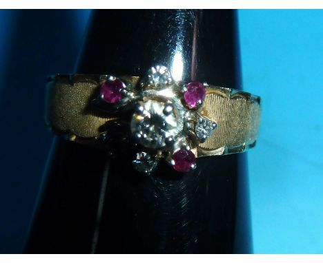 A modern diamond and ruby cluster ring on milled shank, stamped '14K'