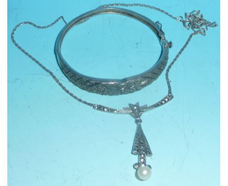 A 1930's white metal and marcasite stiff hinged bangle, and a similar necklet set cultured pearl