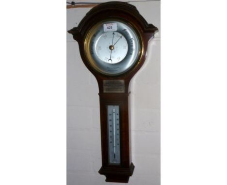 A crossbanded mahogany aneroid barometer with thermometer; a 19th century 1 gallon copper ale jug
