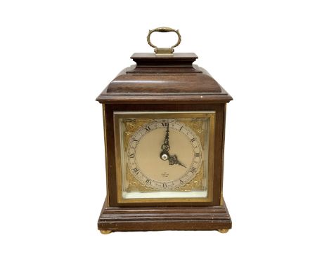Elliott mantle clock in an 18th century bracket clock style case.