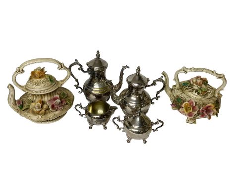 Two Capodimonte teapots, with floral decoration together with a silver plated coffee service