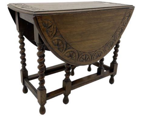 Early 20th century oak dining table, moulded oval drop-leaf top carved with lunettes, gate-leg action base, on spiral turned 