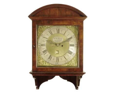  A wall clock, the eight day twin barrel movement striking on three gongs, the eleven and a half inch brass dial with a silve