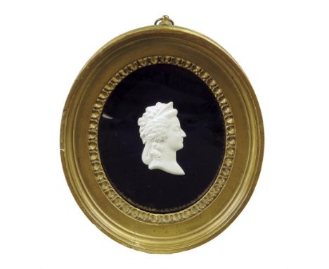  A pair of French biscuit porcelain portrait relief busts of Louis XVI and Marie Antoinette, each on a blue glass mount and i