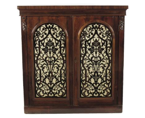  λ A Victorian rosewood demi-lune side cabinet, with a pair of arch moulded glazed doors with inset coromandel fret cut panel