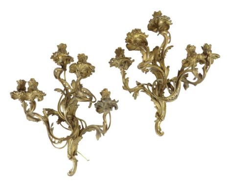  A pair of Louis XV style ormolu five light wall appliques, with scroll arms and foliate nozzles, late 19th century, 48cm hig