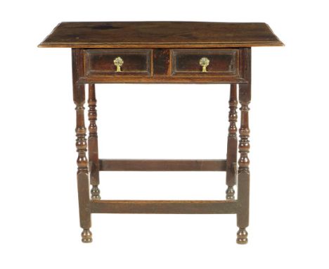  A late 17th century oak side table, the boarded top above a panelled frieze drawer on baluster ring and bobbin turned legs, 