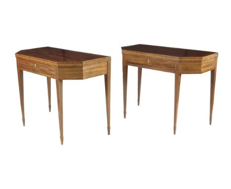  A pair of George III mahogany tea and card tables, inlaid with boxwood stringing, the canted fold-over tops on twin gate sup