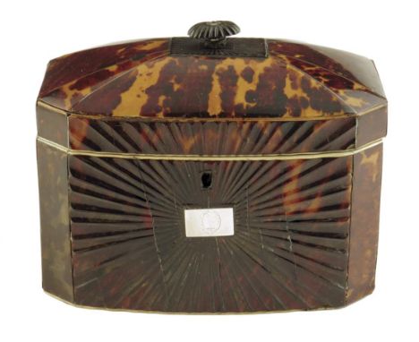 λ A Regency tortoiseshell tea caddy, inlaid with pewter stringing and with ivory edging, with a moulded fan front and a silve