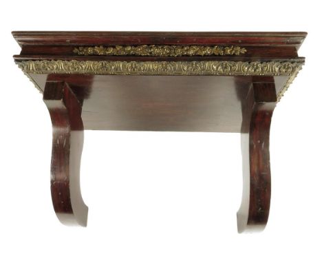 λ A 19th century rosewood and simulated clock wall bracket, with gilt brass mounts, 27.9cm high, 48cm deep.