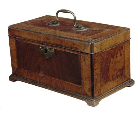  A George II walnut tea caddy, cross and feather banded, with a brass swing handle and a vacant interior, 13.4cm high, 26.2cm