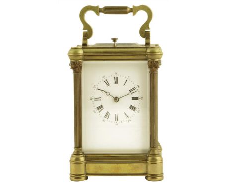  A French gilt brass repeating carriage clock, the lever platform escapement striking on a gong, the white enamel dial with R