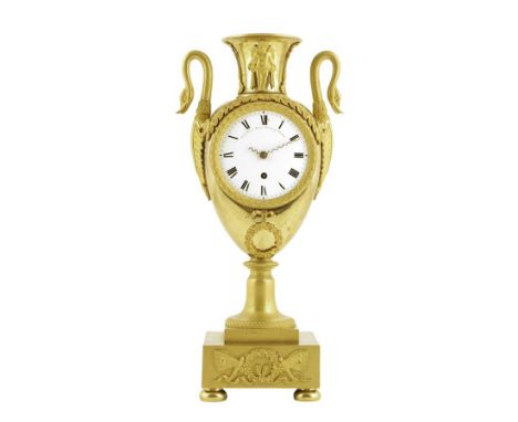  An Empire ormolu mantel timepiece, with a white enamel dial with Roman numerals and inscribed 'C. E. Viner Royal Exchange Lo