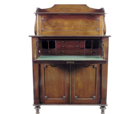  A William IV mahogany secretaire chiffonier, with nulled mouldings, the raised back with brass pole and scroll supports, abo