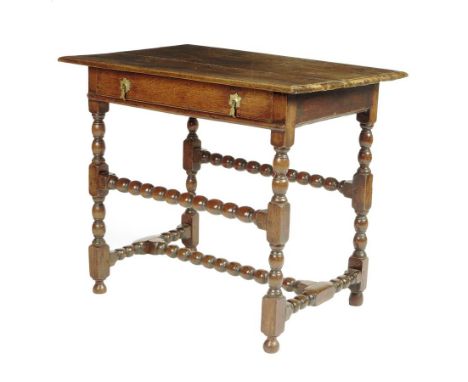  A William and Mary walnut and oak side table, the boarded top above a frieze drawer on bobbin turned stretchered supports, 7