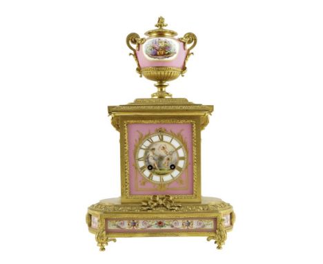  A 19th century French ormolu and porcelain mantel clock, the eight day movement striking on a bell and stamped 'HOLLIN A PAR
