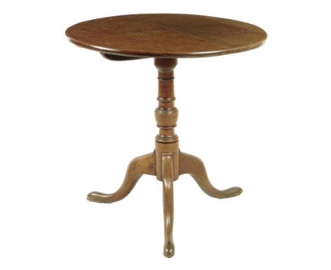  A George III oak tripod table, the circular tilt-top on a vase turned stem, 69.5cm high, 69cm diameter. Provenance: The Coll