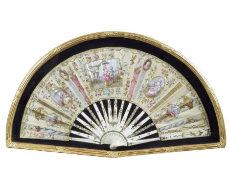 λ A late 18th century French silk fan, with gilt decorated ivory guards and sticks, the fan painted with a central scene of a