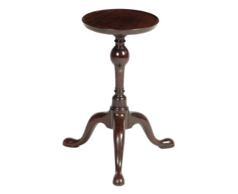  A George II mahogany kettle stand, the dished circular top on an inverted baluster stem and tripod supports, 55.6cm high, 44
