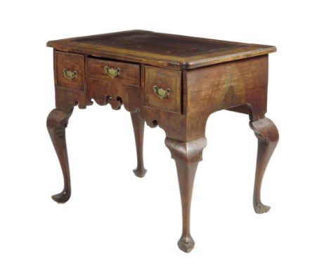  A George II walnut lowboy, the cross and feather banded top with a caddy moulded edge, above three frieze drawers and a shap
