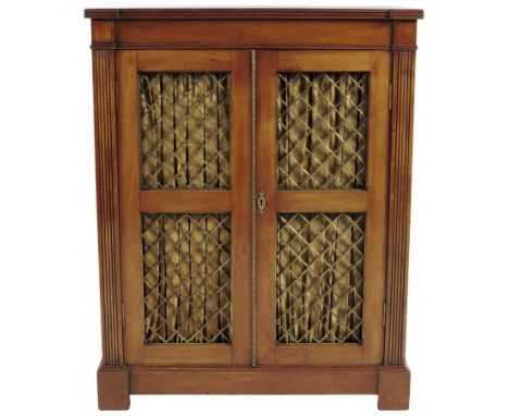  A 19th century mahogany side cabinet, with a pair of gilt brass lattice doors with pleated silk backs, enclosing an adjustab