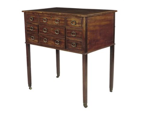 λ A George III mahogany gentleman's dressing table by Gillows of Lancaster, inlaid with boxwood edging, the hinged top reveal