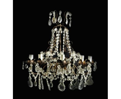  A pair of gilt metal and cut glass five light wall appliques, hung with drops and with scroll branches and petal sconces, 62