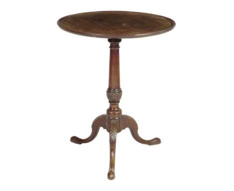  A George III mahogany tripod table, the circular dished tilt-top on a leaf carved and stop fluted stem, 66.4cm high, 54cm di