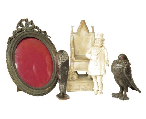 λ A Victorian carved ivory figure of Mr Pickwick, 10.2cm high, a late 19th century brass oval photograph frame, with an easel