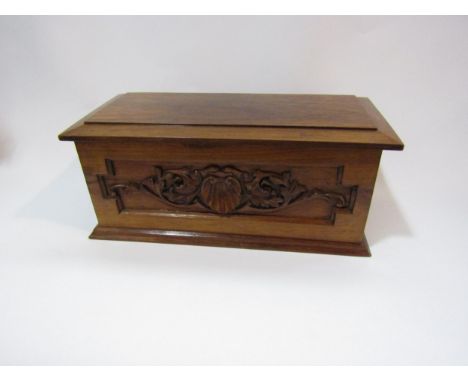 A 1920's/30's hardwood caddy for tea, coffee and cocoa, shell and foliate carved panels, 14cm tall, 33cm long 
